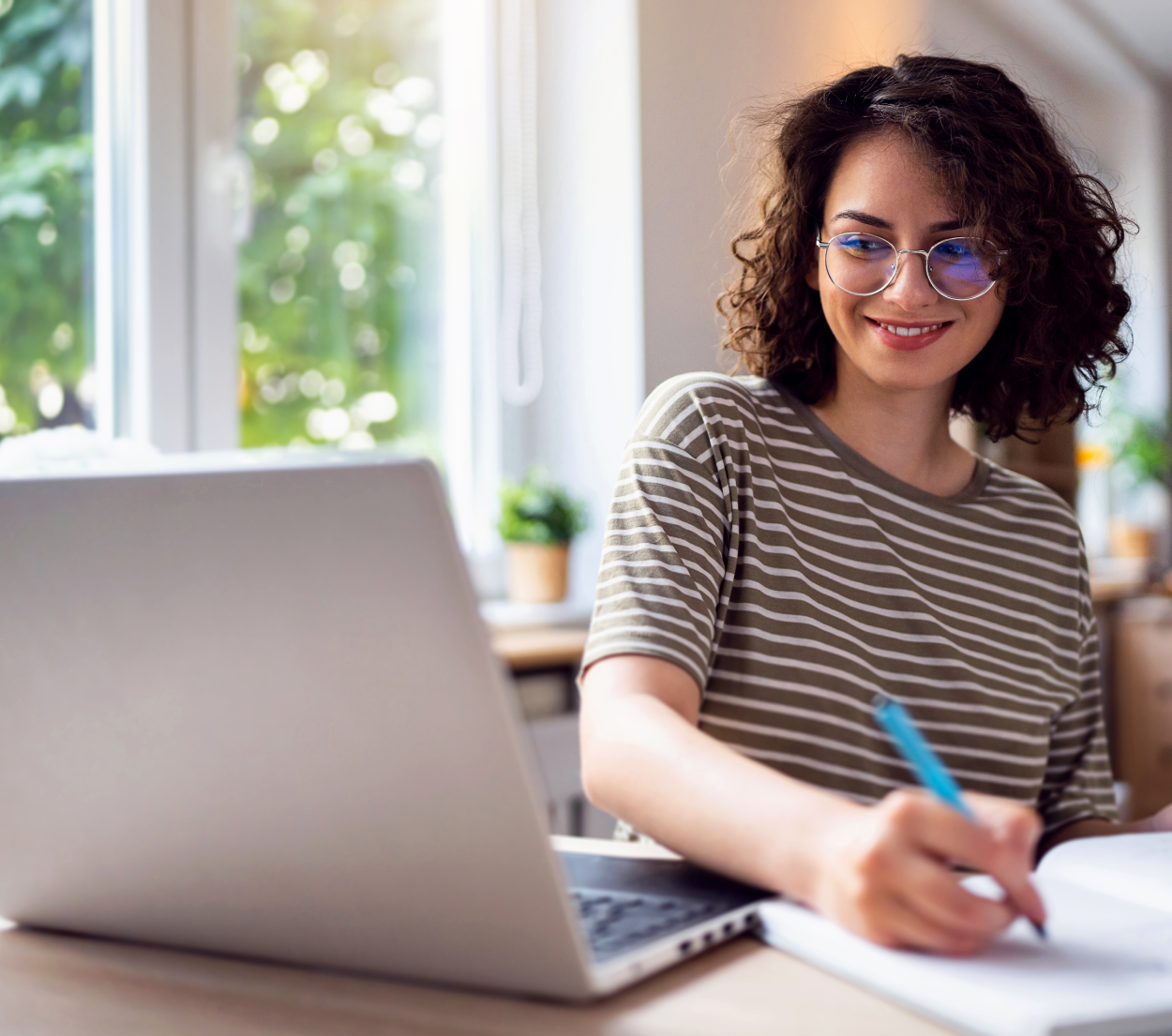 Person at computer, writing